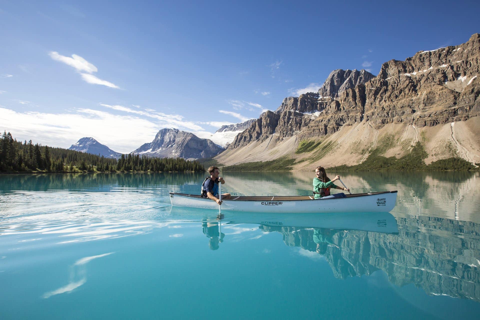 https://www.westtrek.com/wp-content/uploads/2022/11/Canoeing_Bow_Lake_Noel_Hendrickson_2_Pursuit_BanffJasperCollection-1.jpg